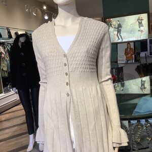 Gorgeous oatmeal colored knit with gorgeous ruffled detail